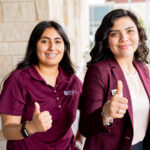 Two smiling participants of Texas A&M University’s Pushing the Education Pipeline (PEP) project give a thumbs-up gesture.