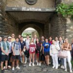 Texas A&M students posing in front of a building in Germany.