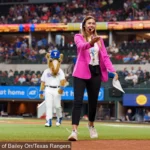 Paige Zizka standing on a baseball field at the Ranger's 2023 World Series title.